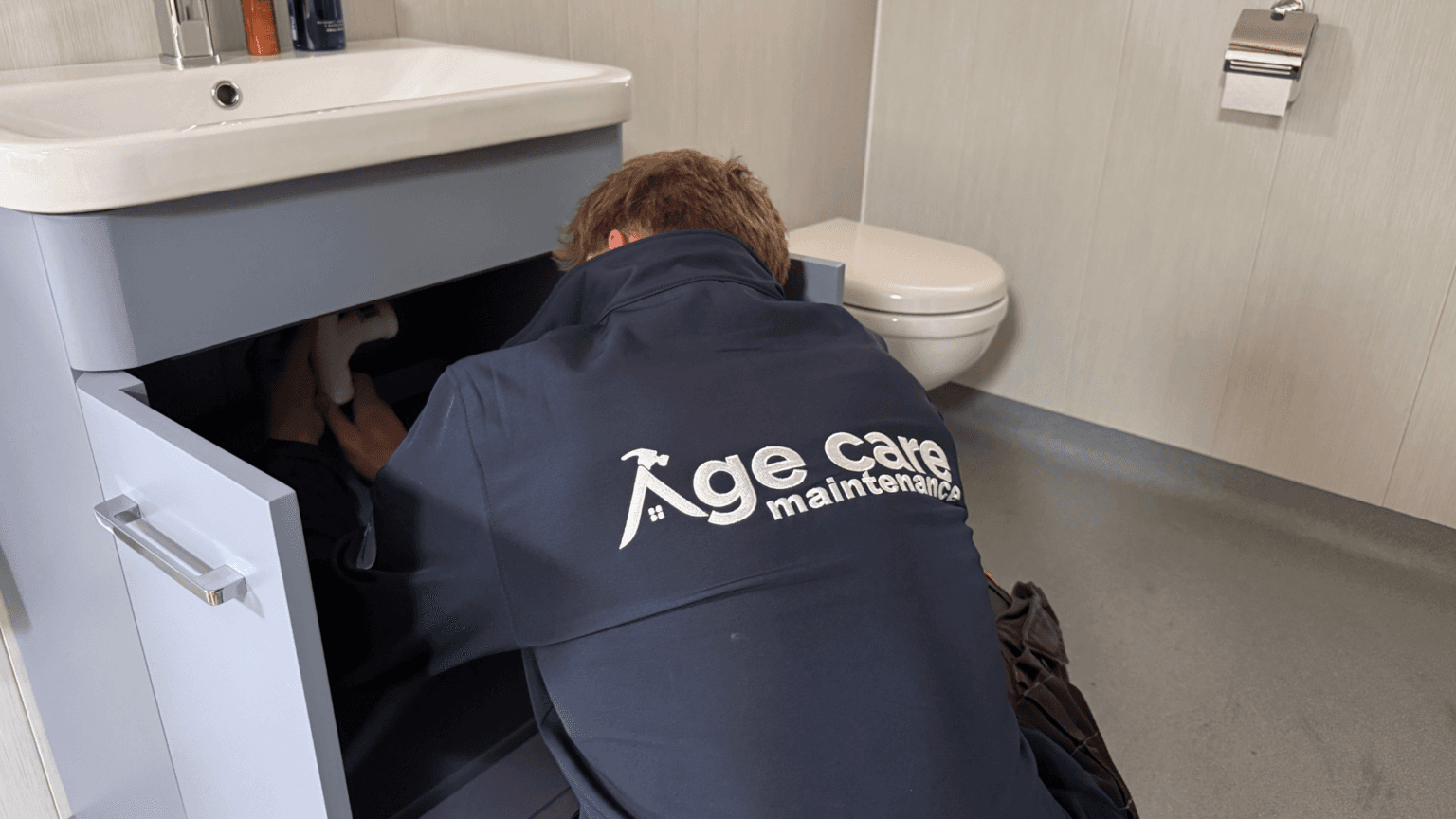 Age Care installer fitting grab rails in a customer's home