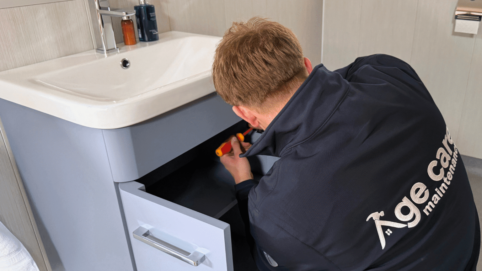 Age Care plumber working in a customer's home